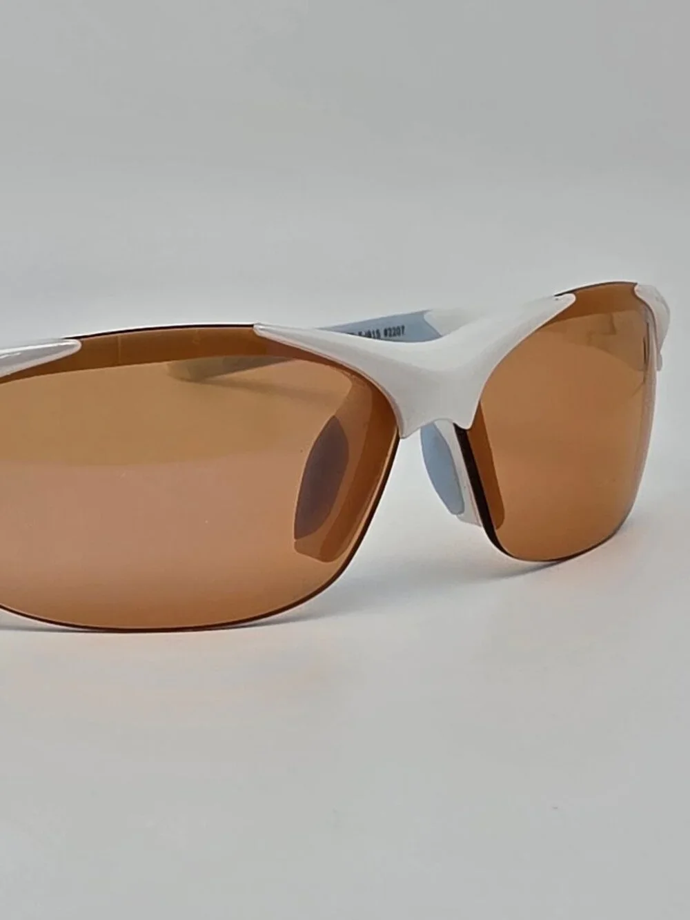 Tifosi Wisp Pearl White Baby Blue Frame Purple Mirror Lens Rimless Sunglasses